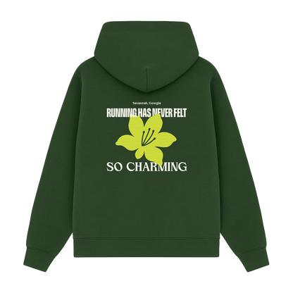 Green hoodie with a yellow flower graphic and text on the back 
